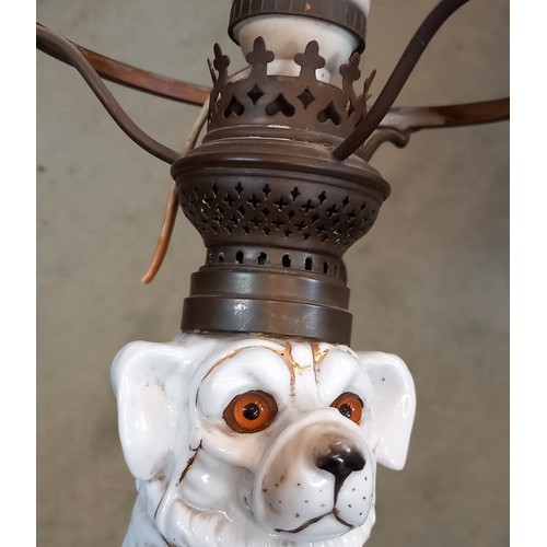 696 - A table lamp, late 19th century/early 20th century, the base modelled as a porcelain dog, with glass... 