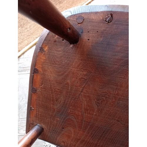 815 - A primitive Welsh ash, elm and beech comb back chair, early 19th century, the stick back and curved ... 