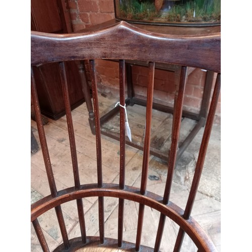 815 - A primitive Welsh ash, elm and beech comb back chair, early 19th century, the stick back and curved ... 