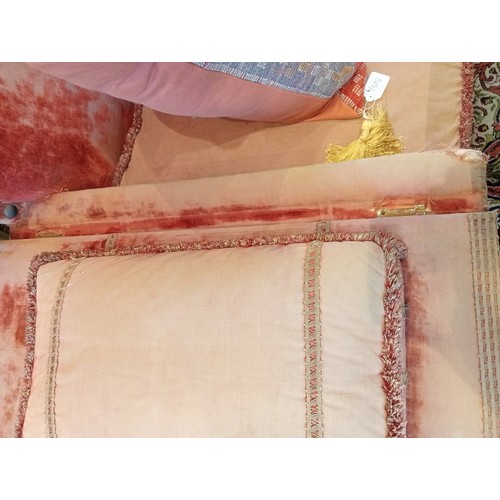 860 - An 18th century knoll or Knole sofa, in pink velour fabric applied with tassel fringes, the straight... 