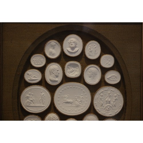 655 - Two Grand Tour style framed and glazed classical plaster intaglio displays, probably early 20th cent... 