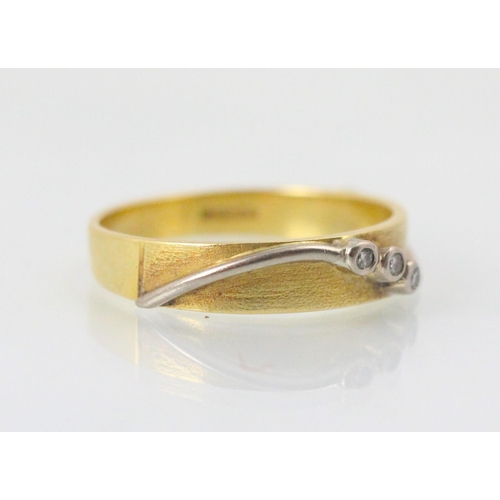 100 - An 18ct yellow gold and diamond ring, the yellow gold matte detailed ring with applied white metal s... 