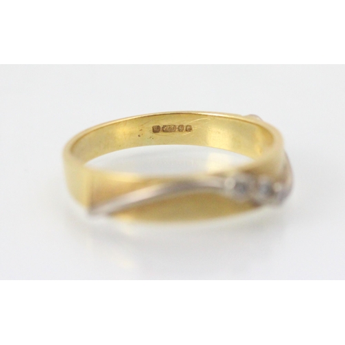 100 - An 18ct yellow gold and diamond ring, the yellow gold matte detailed ring with applied white metal s... 