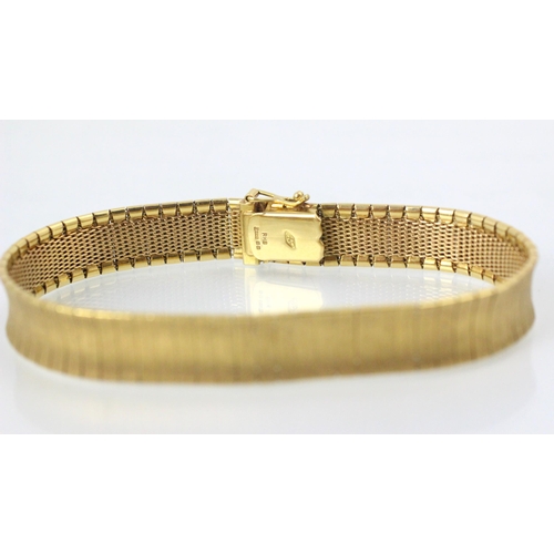 108 - An 18ct yellow gold bracelet, the concave panelled bracelet with matte detail to the front, hidden b... 