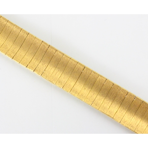 108 - An 18ct yellow gold bracelet, the concave panelled bracelet with matte detail to the front, hidden b... 