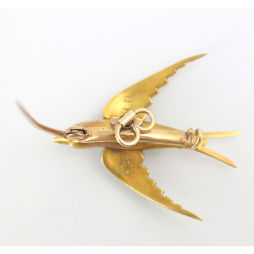 113 - An early 20th century yellow metal and seed pearl set dove brooch, the dove set with graduated seed ... 