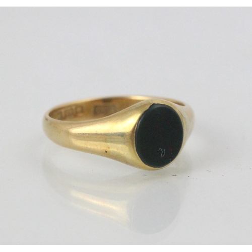 115 - An 18ct yellow gold signet ring, the oval bloodstone leading to a plain polished shank, stamped ‘L&L... 