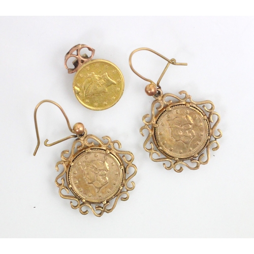 124 - A pair of 19th century tallar coin set earrings, dated 1853 mounted within yellow metal openwork mou... 