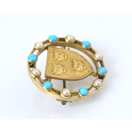 140 - A gold coloured brooch, the circular brooch with paste pearls and turquoise coloured stones, with ce... 