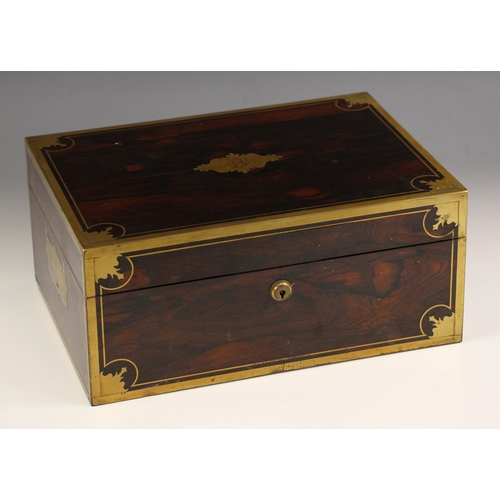 18 - An early 19th century brass bound coromandel vanity case, circa 1840, the hinged cover with decorate... 