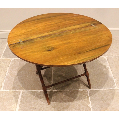 722 - A late 19th century stained beech wood coaching table by Thornton & Herne, the folding circular top ... 