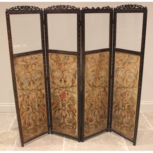 723 - A Victorian mahogany framed and crewelwork three fold dressing screen, each of the four sections wit... 