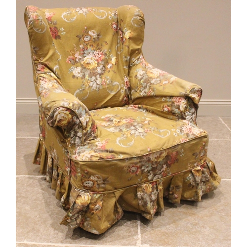 726 - A George III style wingback armchair, late 19th/early 20th century, the padded wing backs and scroll... 