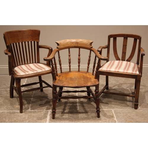 730 - A Victorian fruitwood smokers bow captains chair, with turned baluster spindles over a shaped seat, ... 