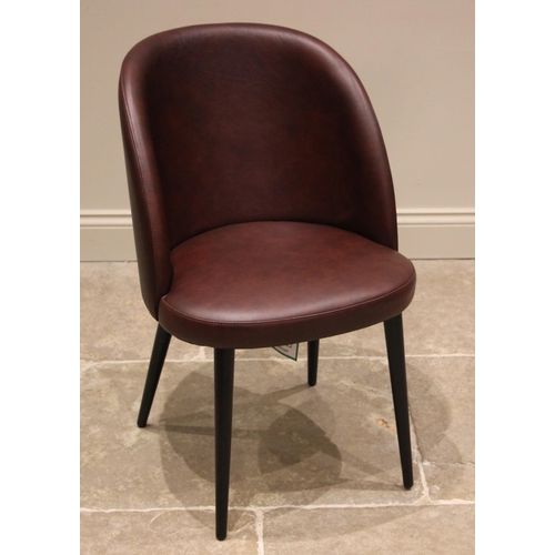 761 - A Heals 'Austen' nut brown leather tub desk chair, the curved back rest over a bow front seat, upon ... 