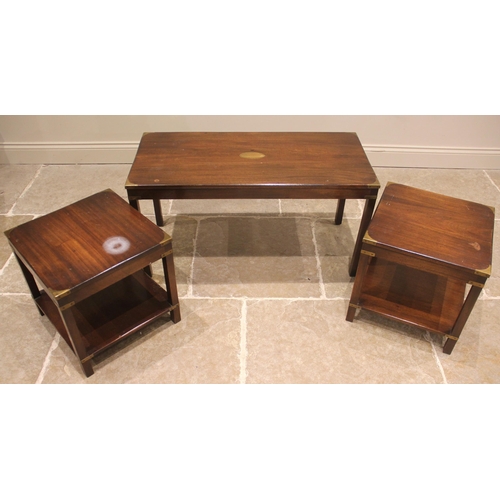 768 - A nest of three mahogany campaign revival tables, late 20th century, to include; a pair of lamp tabl... 