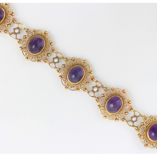 162 - A 9ct yellow gold and untested amethyst set bracelet, the seven openwork panels set with cabochon cu... 