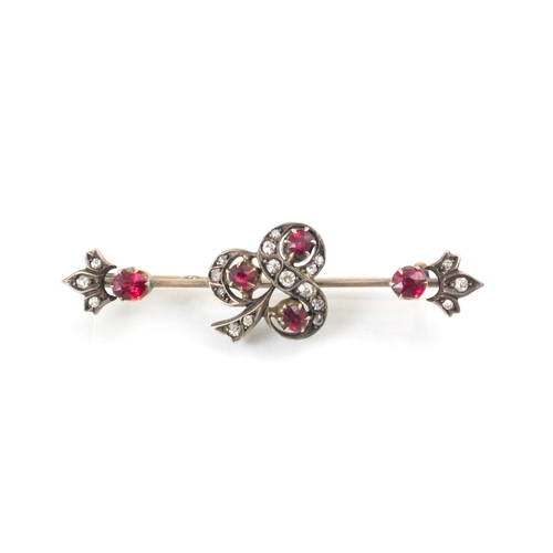 167 - A 19th century untested ruby and diamond brooch, the central motif designed as a three leaf clover, ... 