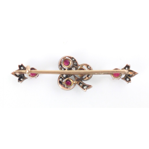 167 - A 19th century untested ruby and diamond brooch, the central motif designed as a three leaf clover, ... 