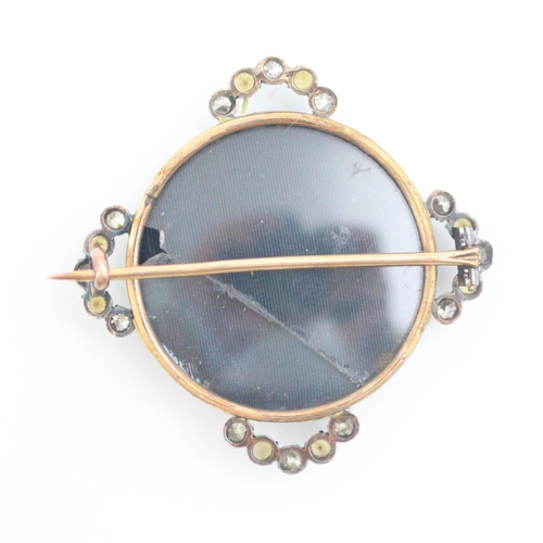 170 - A 19th century diamond and split pearl set brooch, the circular yellow metal brooch set with four cu... 