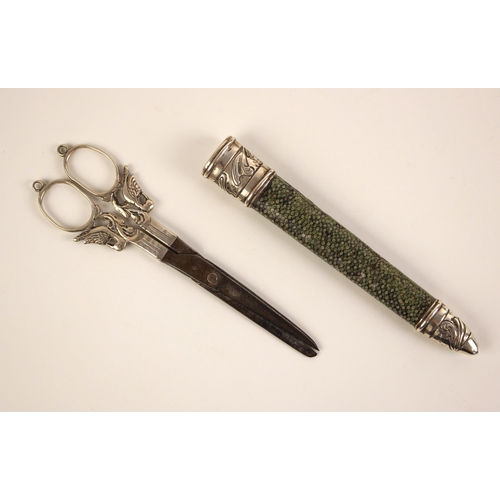 22 - A pair of 19th century shagreen cased scissors, the scissor handles and shanks designed as mythical ... 