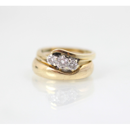 92 - A 9ct yellow gold bespoke diamond ring, the central round cut diamond with smaller diamond to each s... 