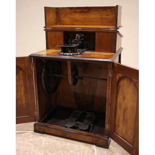 717 - A Victorian figured walnut davenport with integral Japanned 'The Roxburgh' sewing machine by Redpath... 