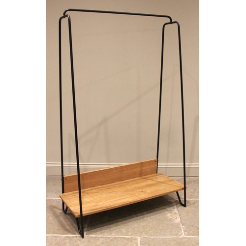 756 - Rob Scarlett for Heals, a contemporary light oak tubular hanging rail, the powder coated frame unite... 