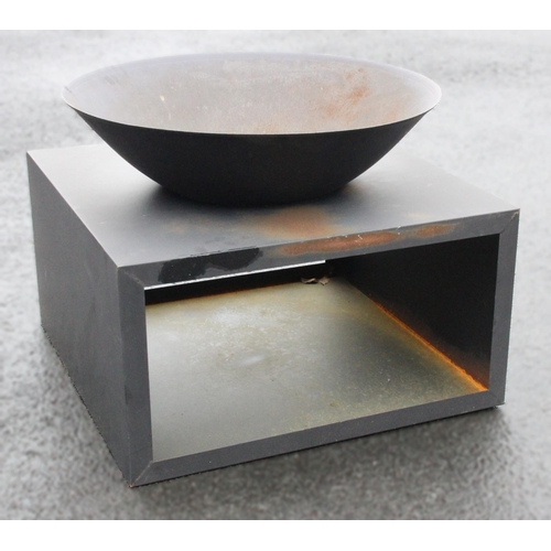 776 - A contemporary metal fire pit, the detachable bowl, 73cm D, within a metal cubic stand, 40cm H x 75c... 