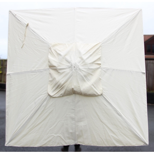 779 - A large garden/patio parasol, by Skagerak, Denmark, folding white fabric cover upon a hardwood pole ... 