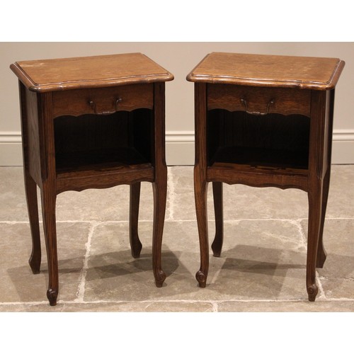 743 - A pair of oak veneered French style bedside cabinets, late 20th century, each of moulded serpentine ... 