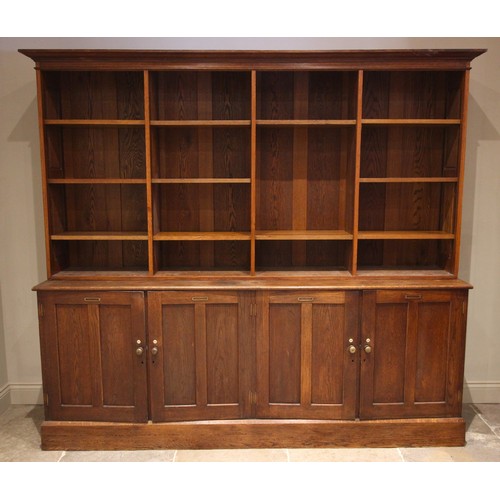 746 - An early 20th century large oak specimen display cabinet/bookcase, originally from Exeter museum, th... 