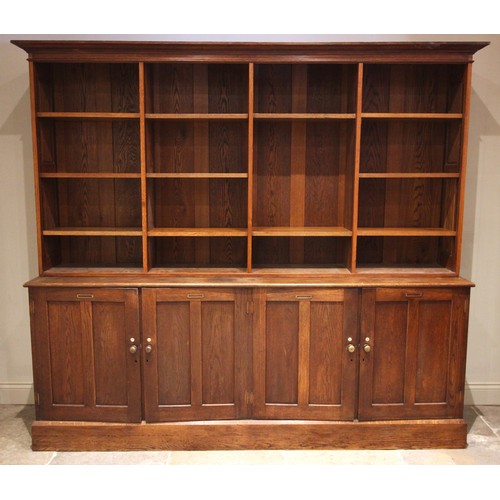 746 - An early 20th century large oak specimen display cabinet/bookcase, originally from Exeter museum, th... 