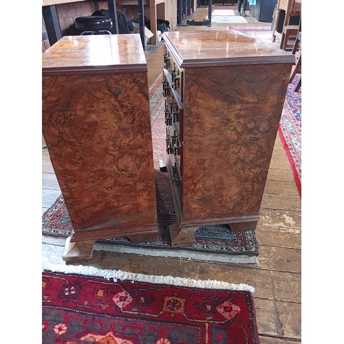 740 - A pair of figured walnut chests, early 20th century and later constructed, each formed with four gra... 