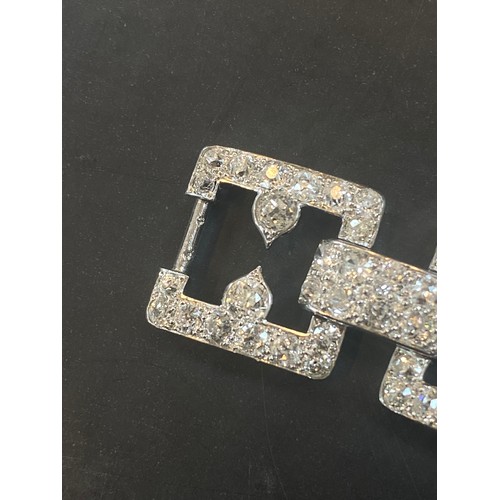 135 - An early 20th century diamond set bracelet, circa 1920, the seven openwork square panels pave set wi... 