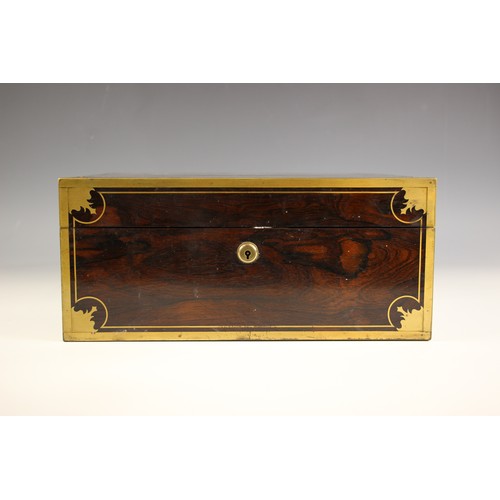 18 - An early 19th century brass bound coromandel vanity case, circa 1840, the hinged cover with decorate... 