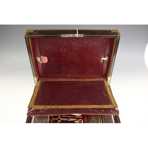 18 - An early 19th century brass bound coromandel vanity case, circa 1840, the hinged cover with decorate... 