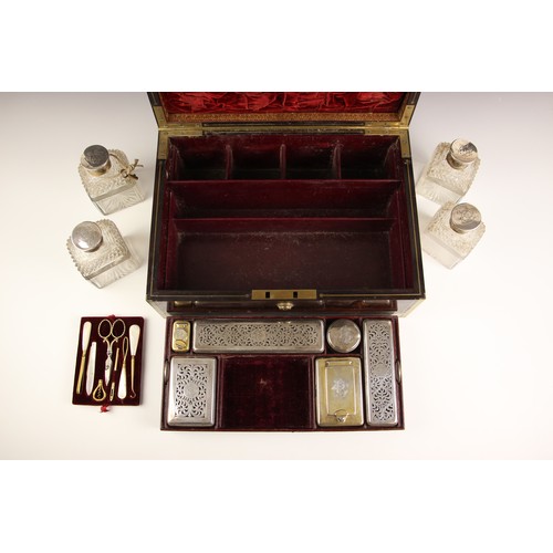 18 - An early 19th century brass bound coromandel vanity case, circa 1840, the hinged cover with decorate... 