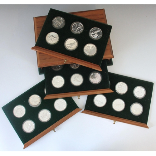 147 - A cased set of International Foreign Crown sized coins, including Kwacha, Pesos, Falkland Island, Ru... 