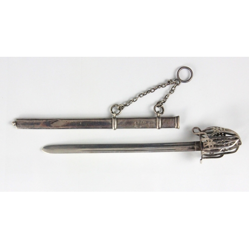 102 - A Victorian silver novelty letter opener, Edward H Stockwell, London 1873, designed as a sword with ... 