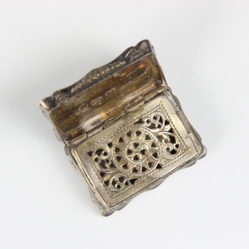 103 - A Victorian silver vinaigrette, Edward Smith, Birmingham 1843, the rectangular hinged cover with sha... 