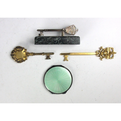 106 - A selection of silver and gold coloured items, including a George VI silver and enamel compact, the ... 