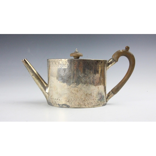 108 - A George III silver teapot, London 1788, the hinged cover above oval body with engraved floral decor... 