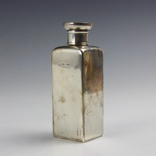 113 - A George VI  Art Deco silver flask, 'PWG' London 1937, the screw cap with engraved crest depicting a... 