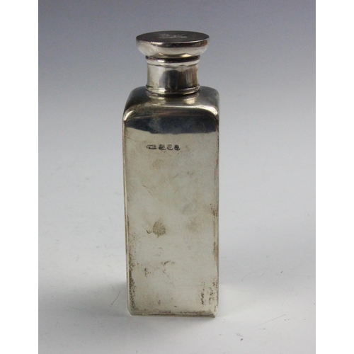 113 - A George VI  Art Deco silver flask, 'PWG' London 1937, the screw cap with engraved crest depicting a... 