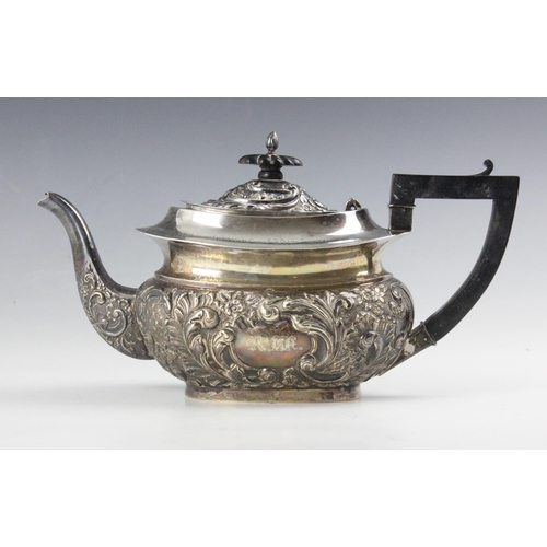 117 - An Edwardian silver teapot, Eustace George Parker, Birmingham 1902, the embossed hinged cover above ... 