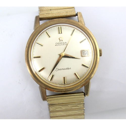 137 - A yellow metal cased Omega Seamaster automatic wristwatch, the circular cream dial with baton marker... 