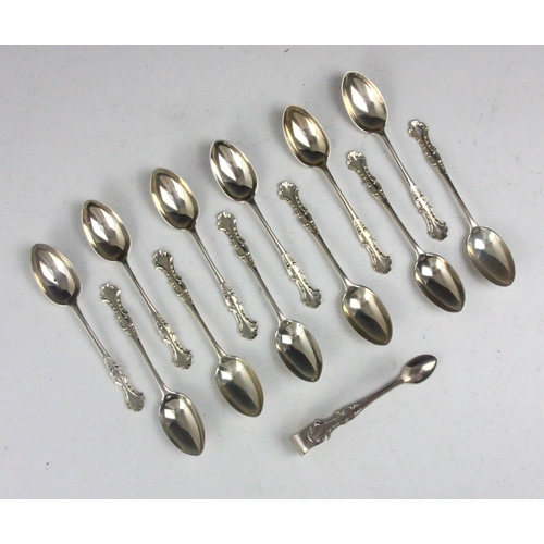 19 - A set of twelve Edwardian silver teaspoons, Josiah Williams & Co, London 1905, with cast scrolling d... 