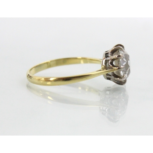 284 - A 20th century diamond solitaire ring, the old cut diamond with white metal claws leading to plain p... 