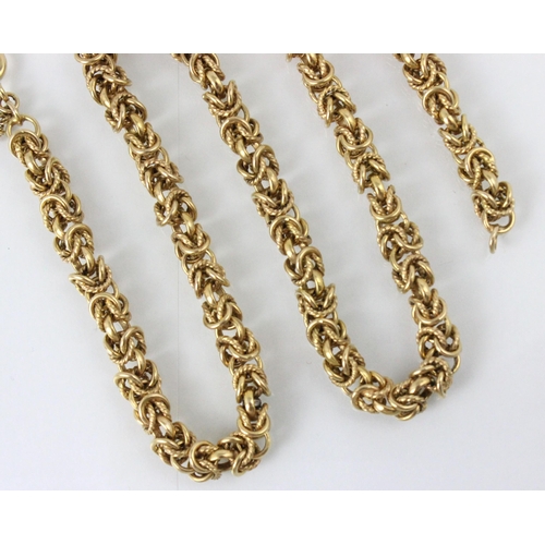 200 - A yellow metal necklace, the fancy link chain with intertwined plain polished and textured links, wi... 